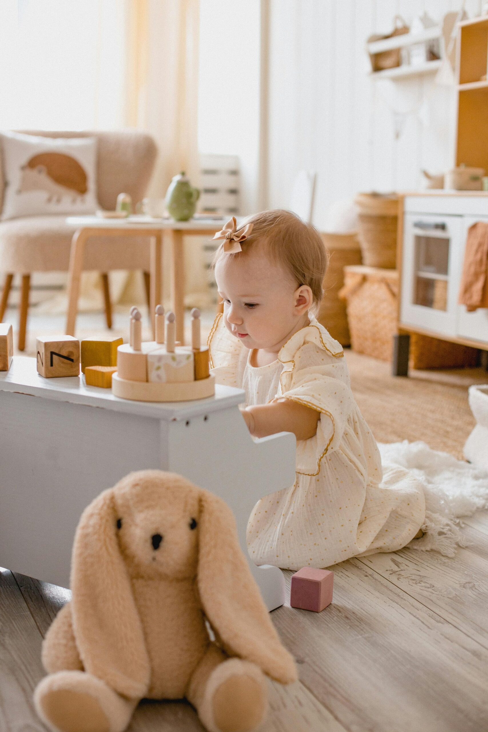 A baby playing with a toy piano in a room